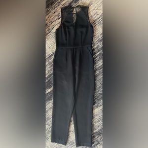 BCBGeneration Black jumpsuit. Lace on top. Back zipper with pockets